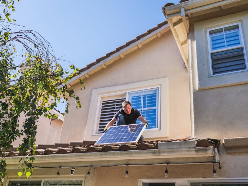 Installer working on a residential rooftop