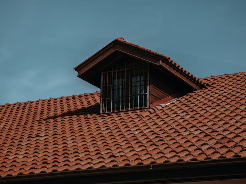 Traditional tiled roof with an attic dormer window